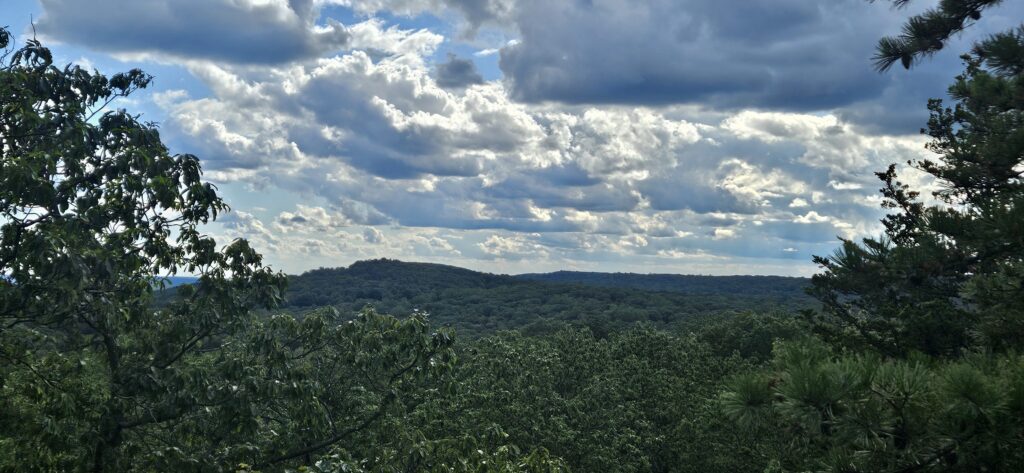 An image of an overlook featuring rolling mountains