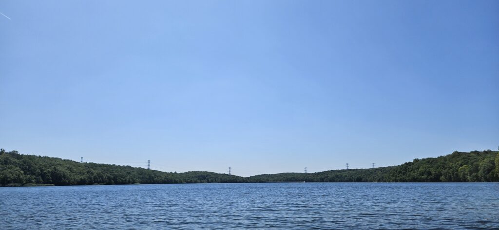 An image of Splitrock Reservoir featuring power lines in the background