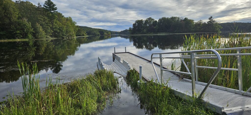 An image of a boat launch on a serene lake