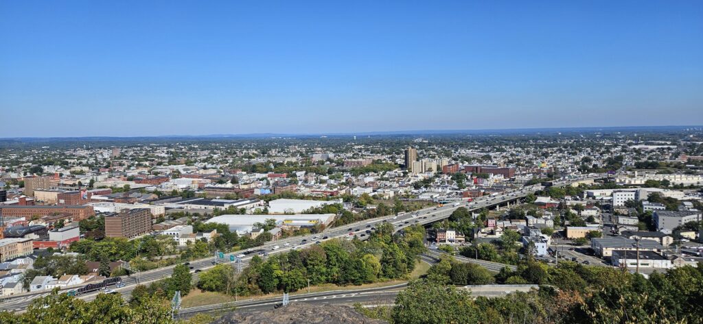 An image of an overlook over highways and the city of Paterson at Garret Mountain