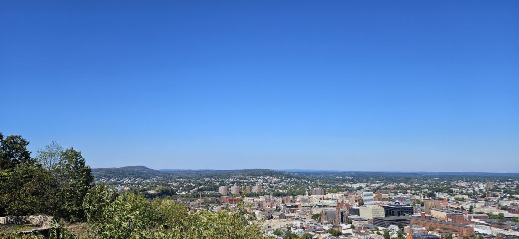 An image of an overlook over the city of Paterson and of the mountains at Garret Mountain