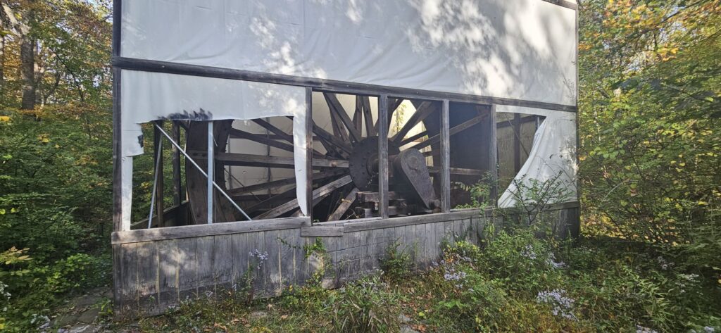 An image of a covered water wheel