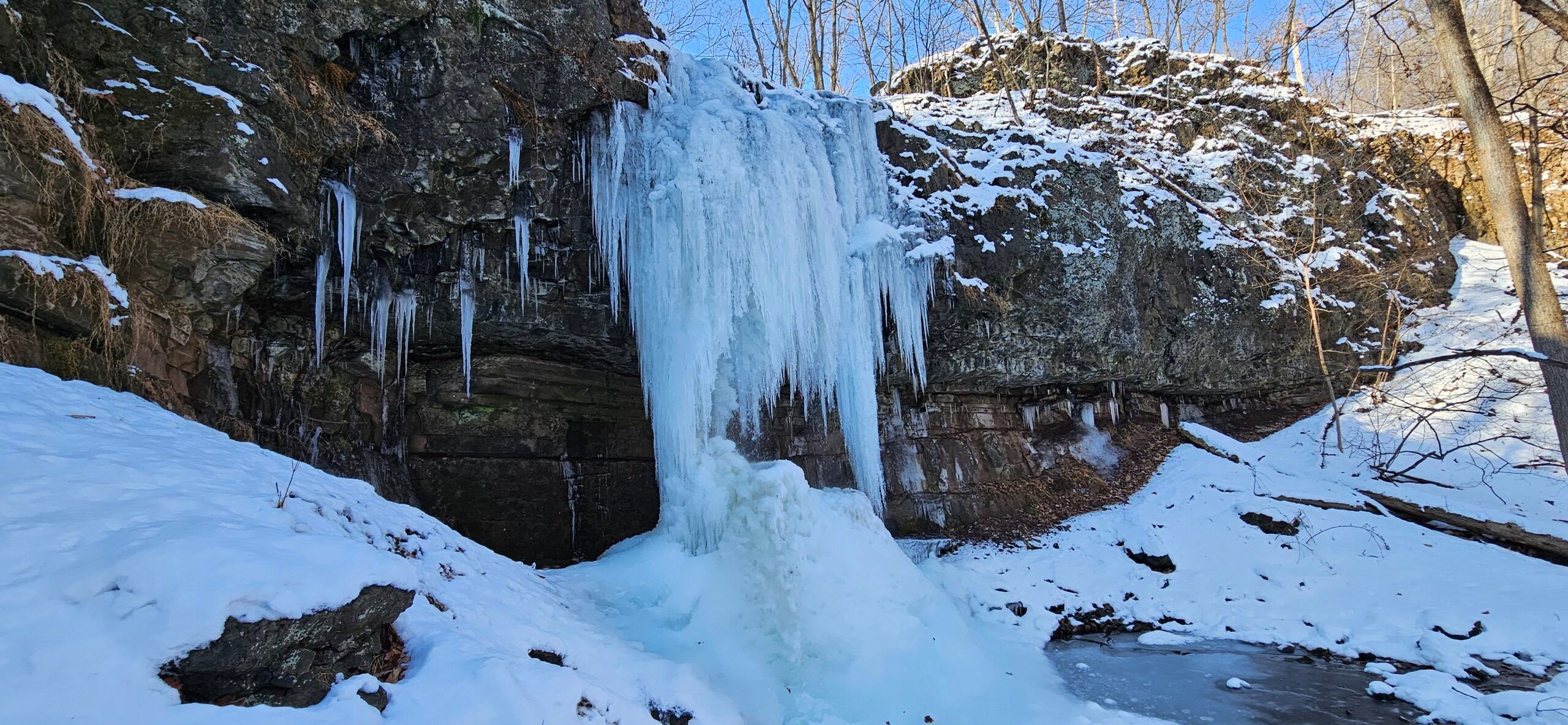 Walking Behind a Frozen Waterfall at Bridal Veil Falls