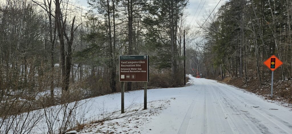 An image of the sign for Van Campens Glen in the winter