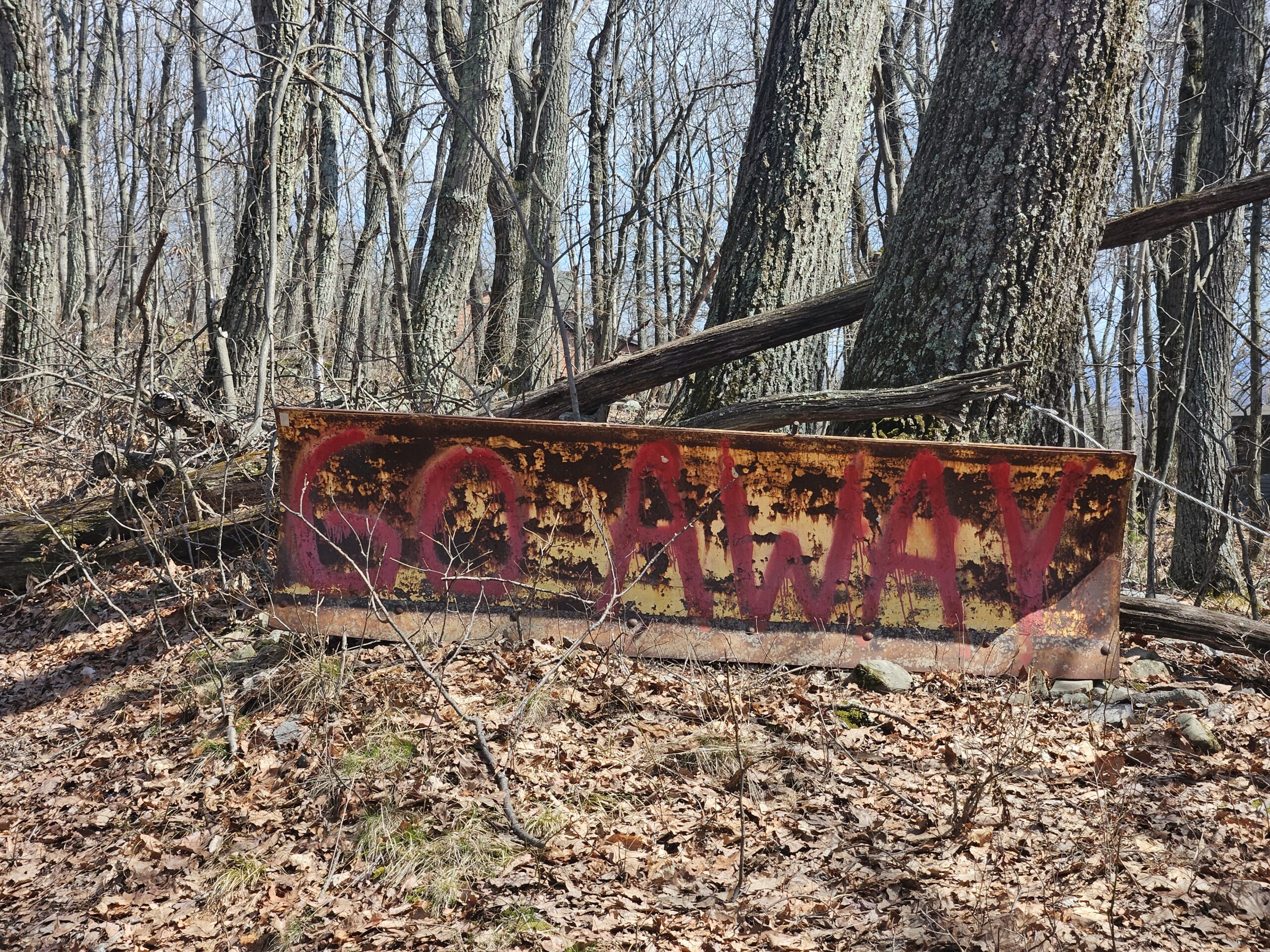 An image of a snow plow with the words "go away" written on it in the wods