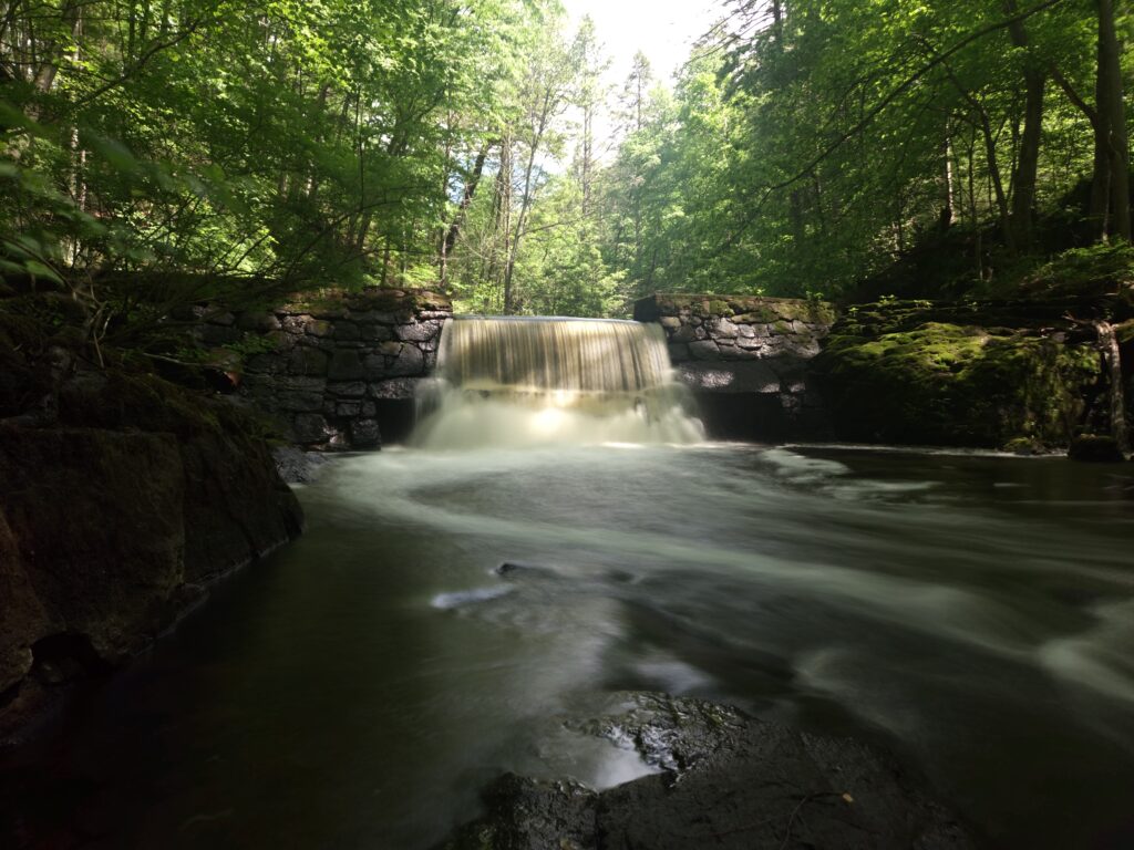 A long exposure image of the dam waterfall at the Kay Center