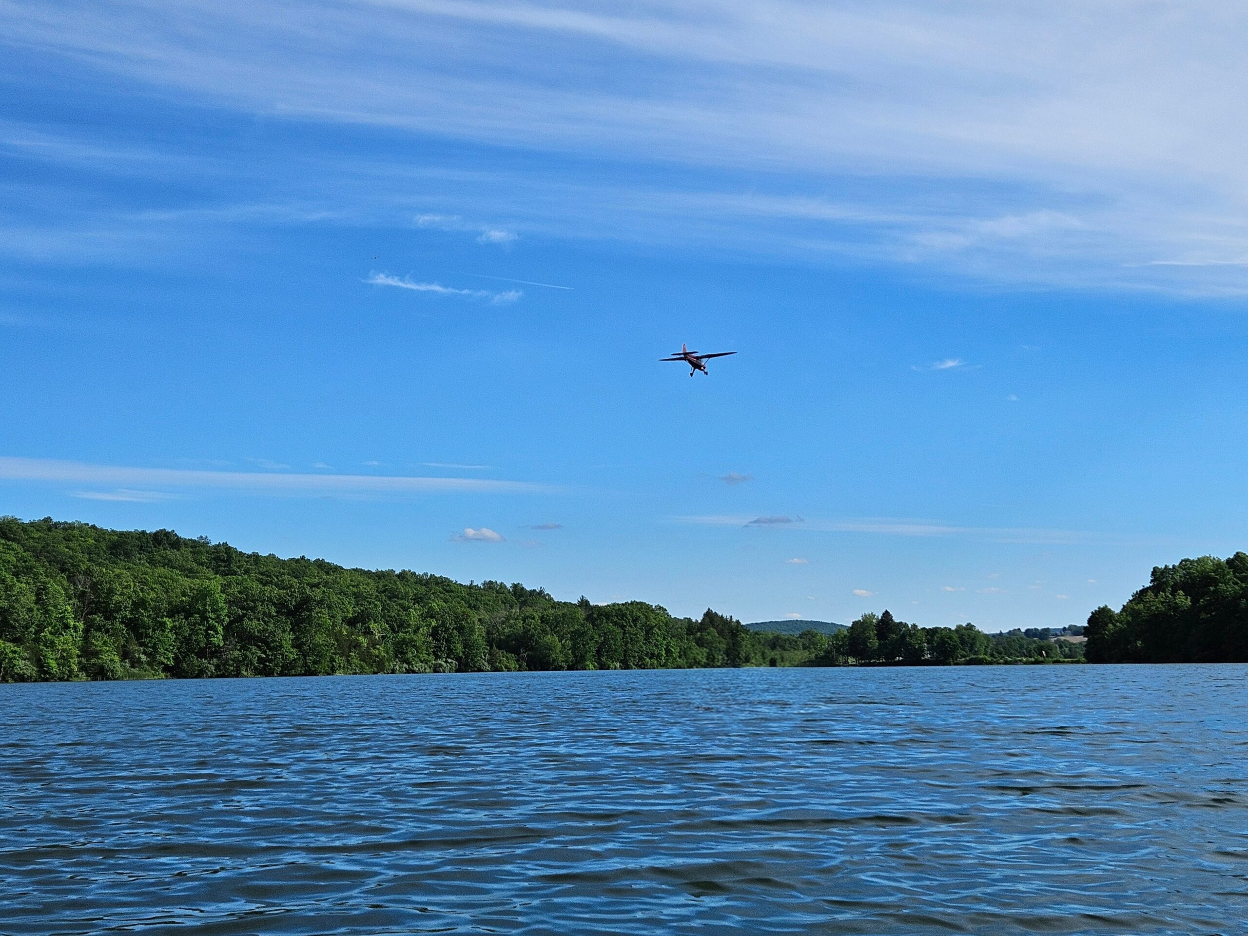 A plane landing above Lake Aeroflex at Kitatinny Valley State Park