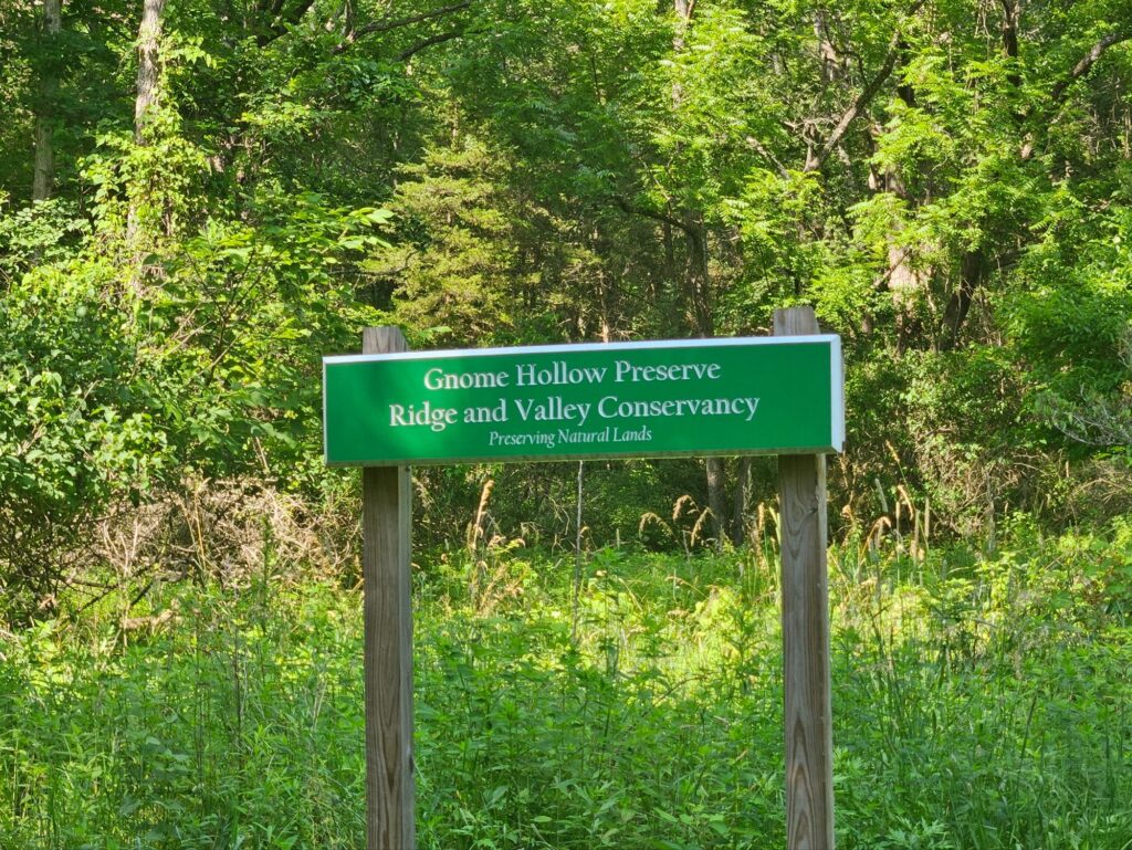 An entrance sign for Gnome Hollow Preserve