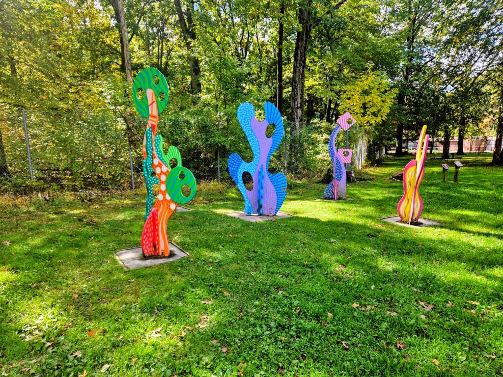 An abstract, multi-colored sculpture titled “Fantastical Garden” by Dan Fenelon at South Mountain Reservation